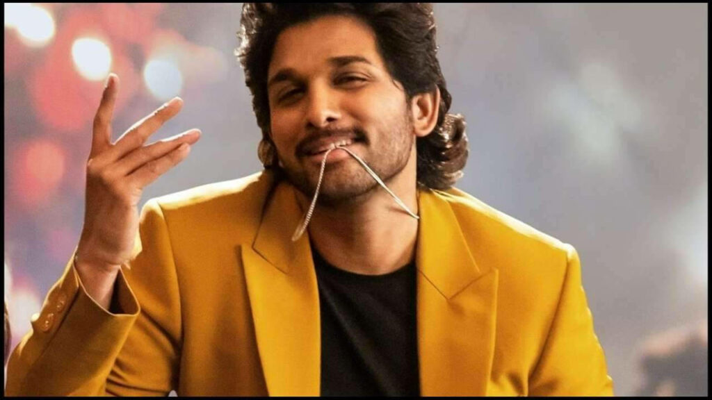 Allu Arjun in yellow blazer stylishly biting necklace vibrant wallpaper background image