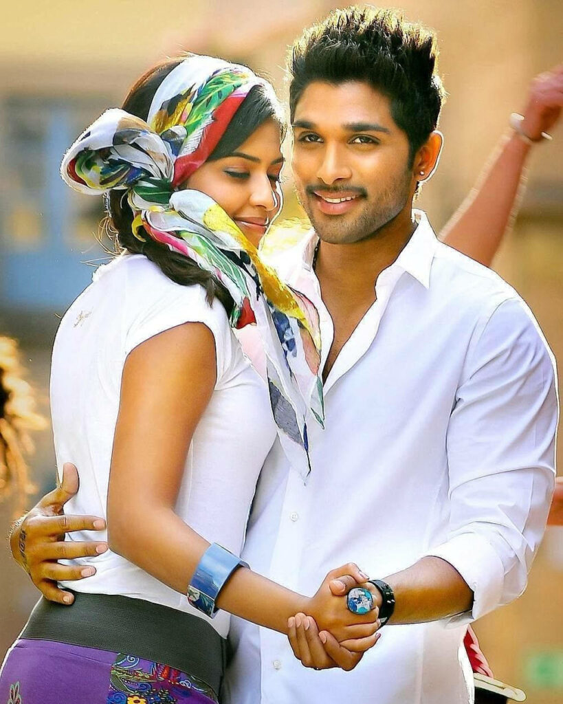 Allu Arjun and Amala Paul dancing joyfully vibrant colorful scarf stylish bracelets wallpaper background