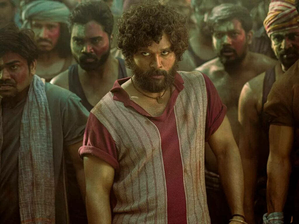 Allu Arjun as Pushpa with determined allies intense powerful film scene wallpaper background