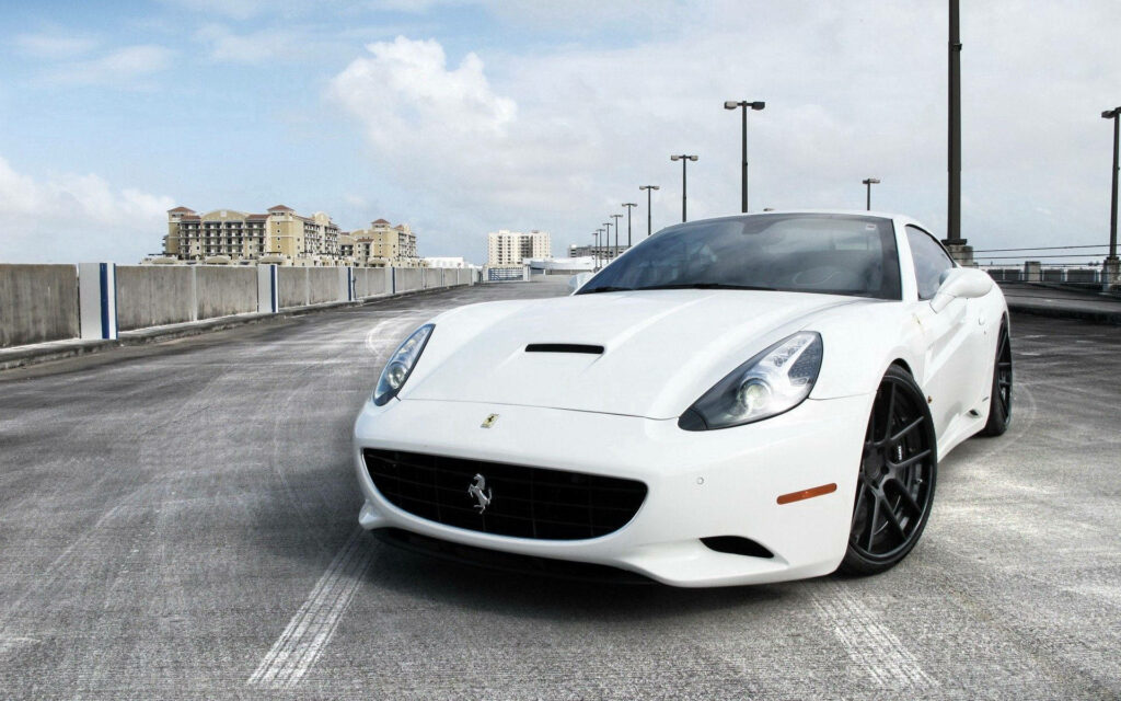Exquisite Elegance: Unveiling the Phenomenal White Ferrari California in a Radiant Environment Wallpaper