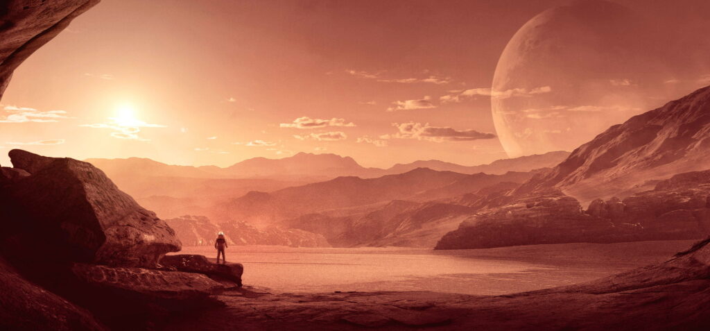 Solitude on Red Planet: A Majestic 4K Wallpaper of an Astronaut Gazing at the Endless Sci-Fi Sky on Mars