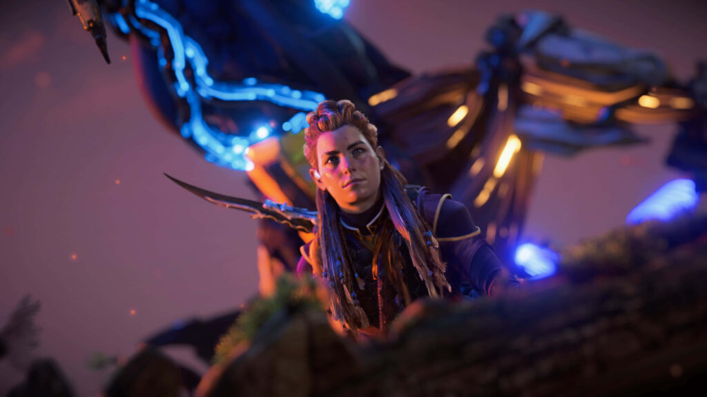 Aloy poised with glowing dragon behind her dramatic adventurous wallpaper background