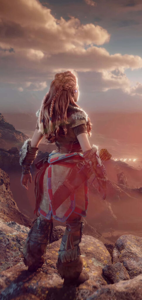 Aloy standing strong on rugged mountaintop overlooking sunset landscape adventure wallpaper