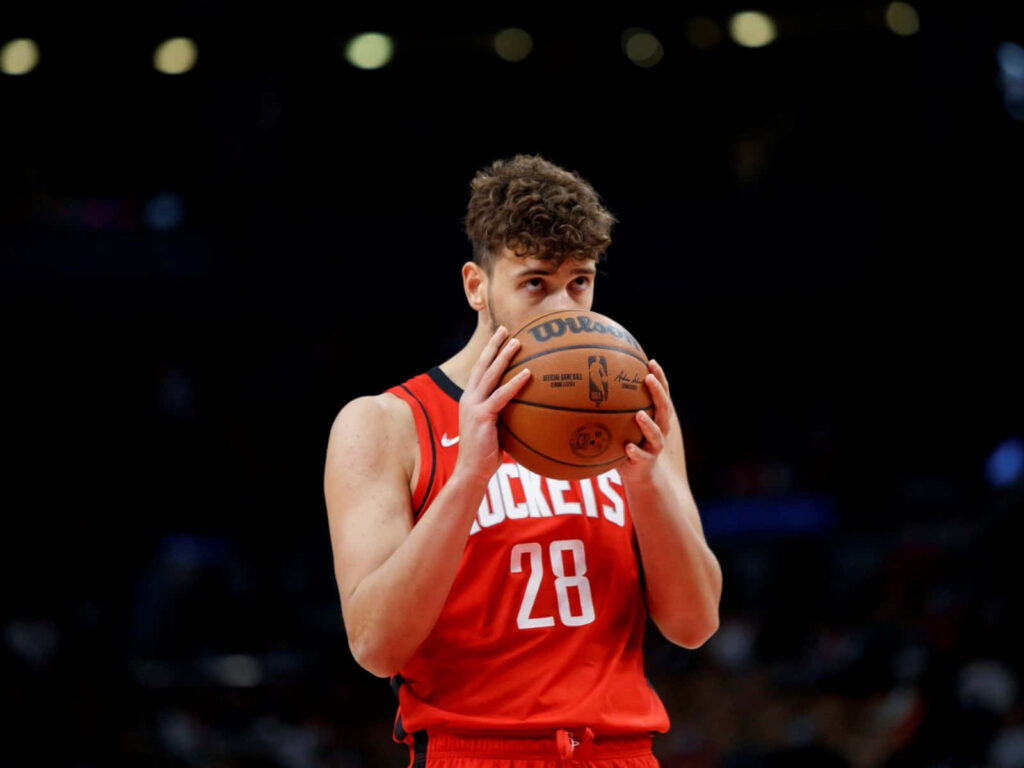 Alperen Şengün focused at free throw line during basketball game concentration wallpaper background