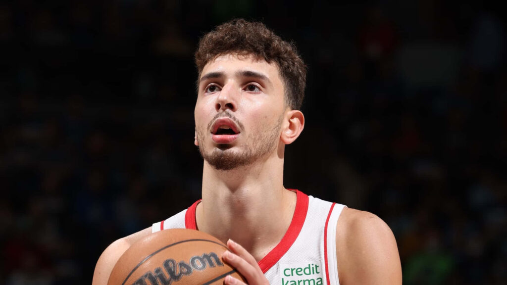 Alperen Şengün concentrates intensely taking a free throw in a basketball game wallpaper background