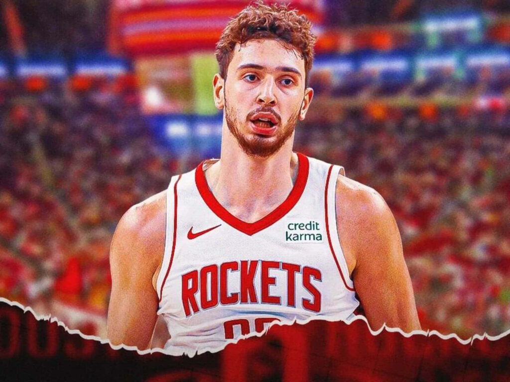 Alperen Şengün in Houston Rockets jersey playing basketball action vibrant arena background Wallpaper