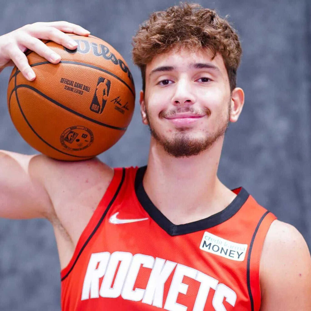 Alperen Şengün holding basketball shoulder Houston Rockets jersey basketball fan wallpaper background