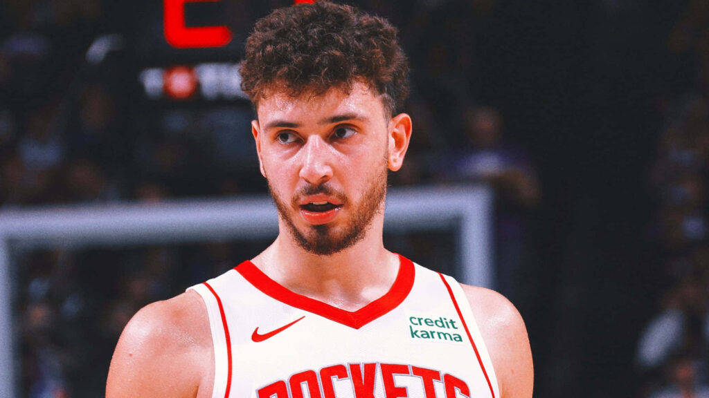 Alperen Şengün in Houston Rockets jersey focused during basketball game wallpaper background