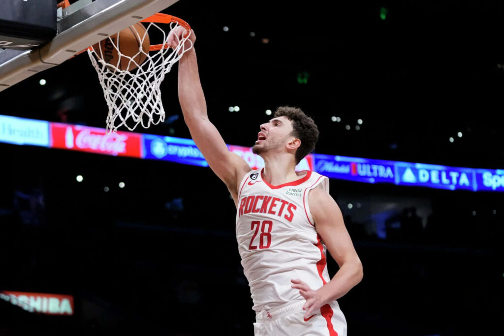 Alperen Şengün Houston Rockets powerful dunk dynamic basketball game energy wallpaper background