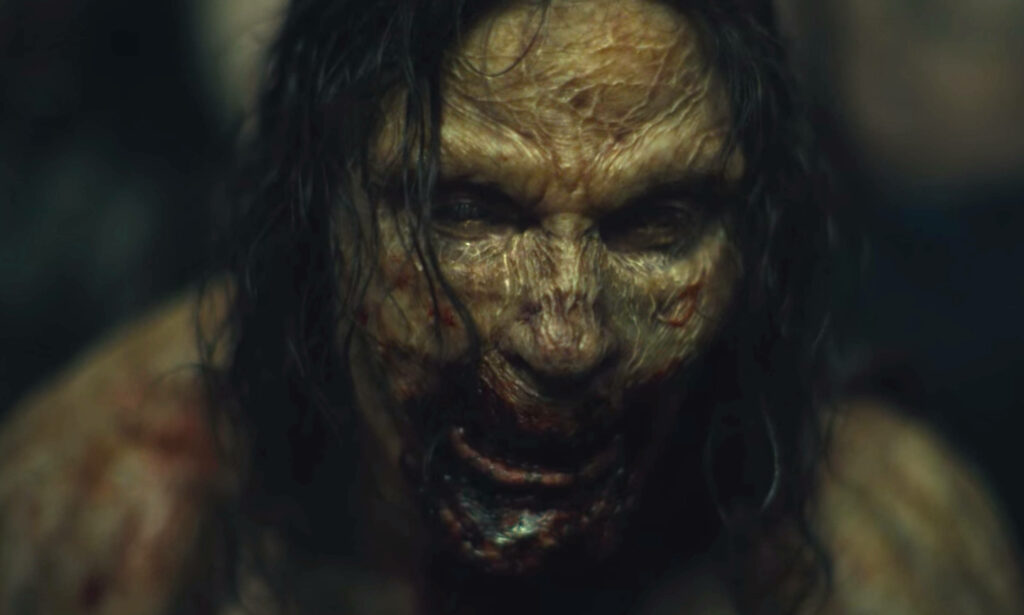 Close up of Alpha zombie from Army of the Dead with menacing decayed features wallpaper background