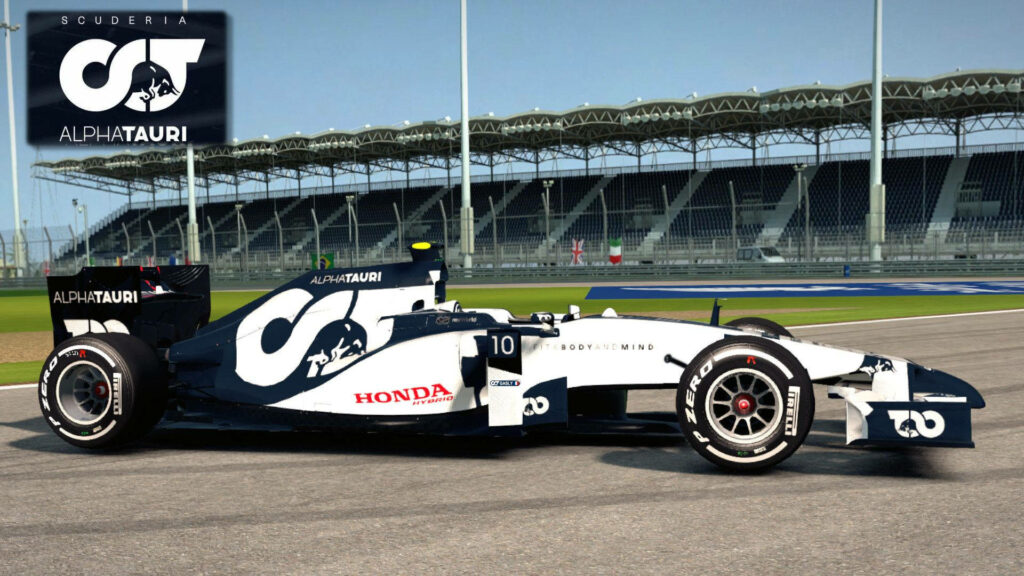 Alphatauri racing car speeding on pro race circuit with bold sponsor logos and empty grandstand Wallpaper
