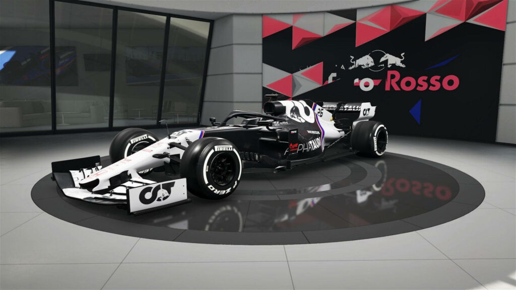 Alphatauri racing car in modern showroom with geometric walls and Toro Rosso branding background Wallpaper