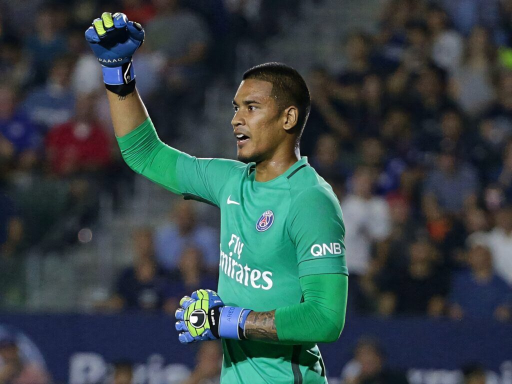 Alphonse Areola celebrating in green PSG goalkeeper kit during football match wallpaper background
