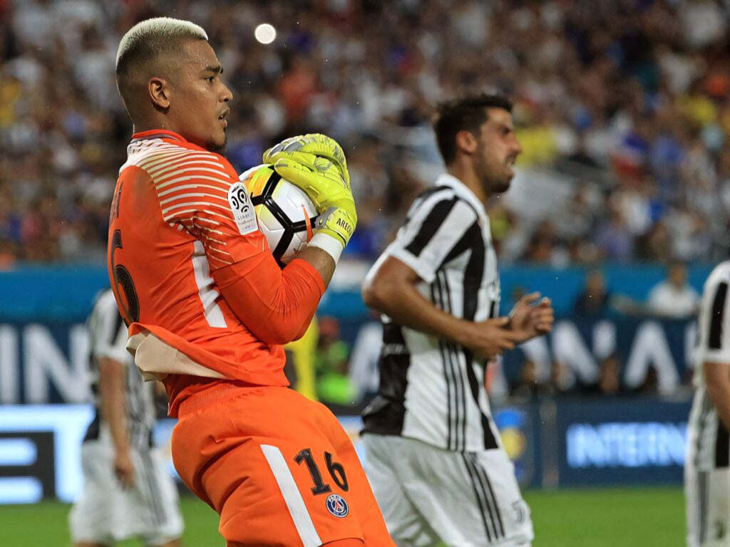 Alphonse Areola goalkeeper in action holding soccer ball during intense football match wallpaper
