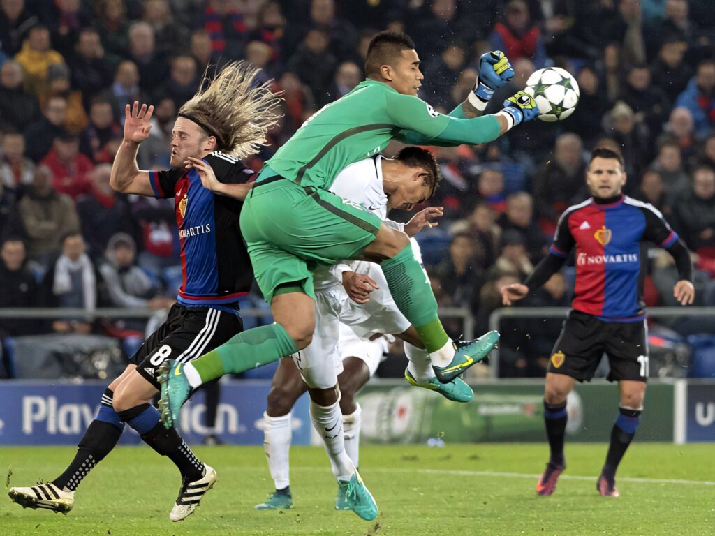 Alphonse Areola collides with opponent during intense football match dramatic on-field action wallpaper