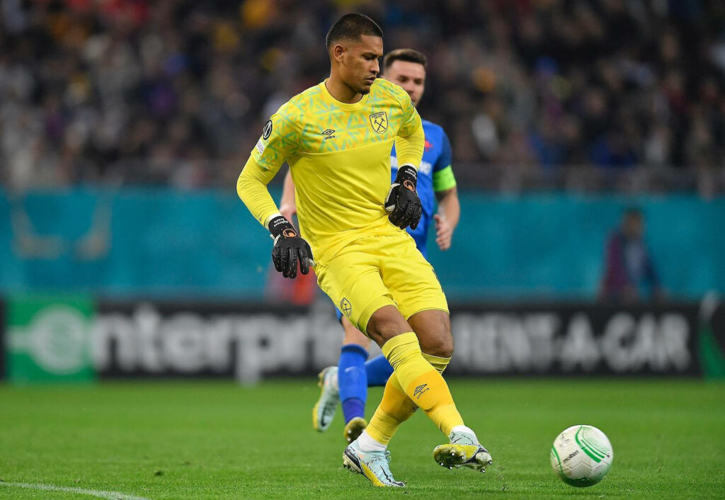 Alphonse Areola in yellow goalkeeper kit chasing ball showing agility and defensive skills Wallpaper