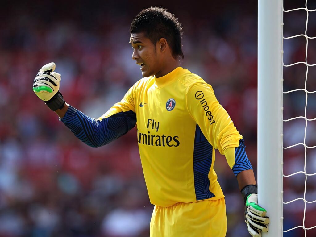 Alphonse Areola in yellow PSG goalkeeper kit signaling with gloved hand focused side view Wallpaper