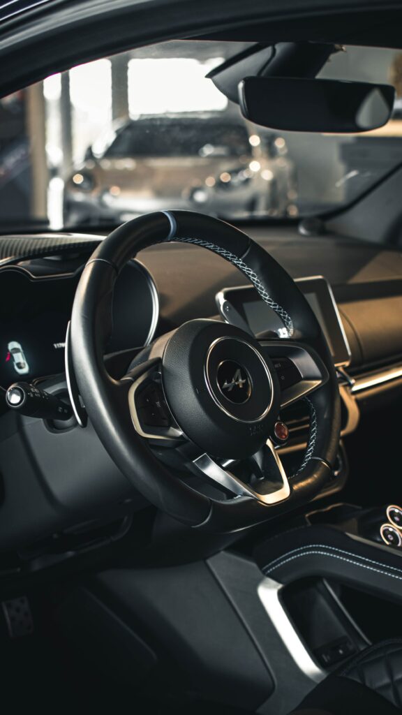 Alpine A110 Interior: Luxury Steering Wheel & Stylish Car Salon Wallpaper