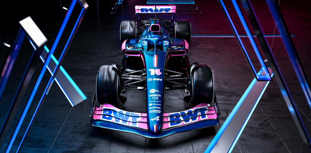 Front view of Alpine Car 14 with bold blue pink livery under dynamic futuristic lighting wallpaper