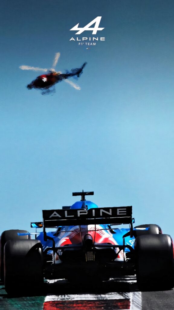 Alpine F1 Team car racing on track with helicopter flying in clear blue sky motorsport wallpaper