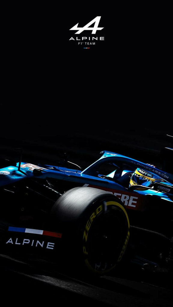 Alpine F1 car low light racing shot blue livery sleek aerodynamic design wallpaper background
