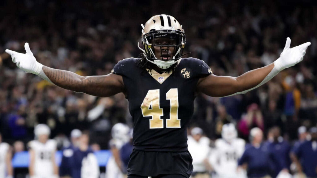 Alvin Kamara New Orleans Saints running back celebrates on field with crowd background wallpaper