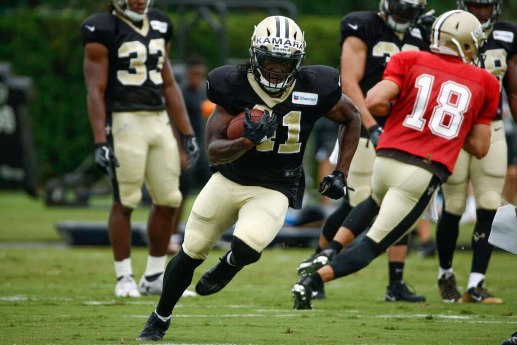 Alvin Kamara #41 New Orleans Saints making dynamic football play showcasing athleticism wallpaper