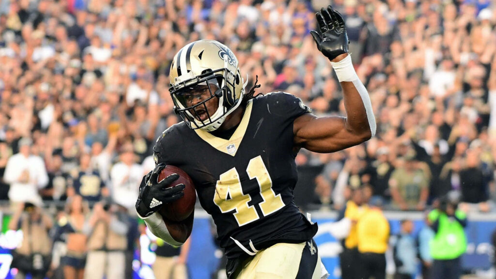 Alvin Kamara New Orleans Saints sprinting full speed football action dynamic athleticism wallpaper