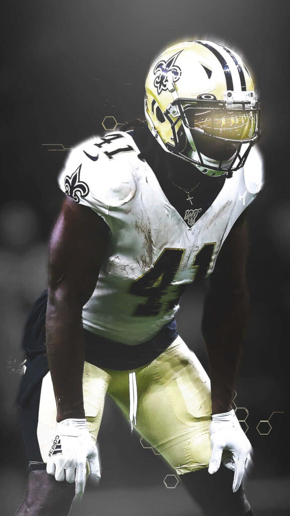 NFL superstar Alvin Kamara focused and ready for action dynamic football wallpaper background