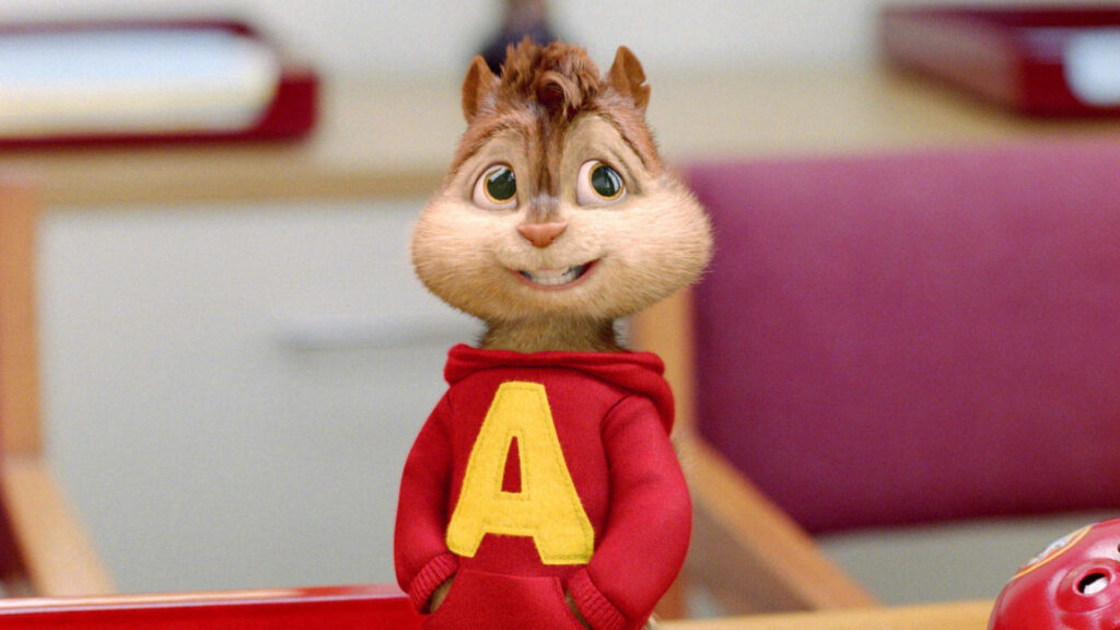Alvin Seville smiling in red hoodie with yellow A in cozy room wallpaper background