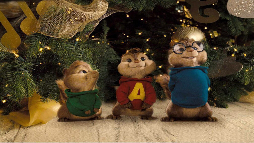 Alvin and the Chipmunks in signature outfits posing by decorated Christmas tree festive background Wallpaper