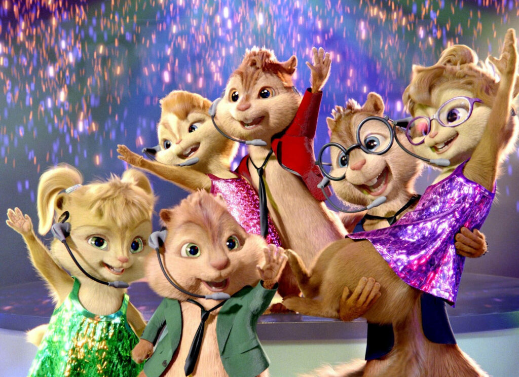 Alvin and the Chipmunks and Chipettes performing live on stage with colorful costumes and sparkling background Wallpaper