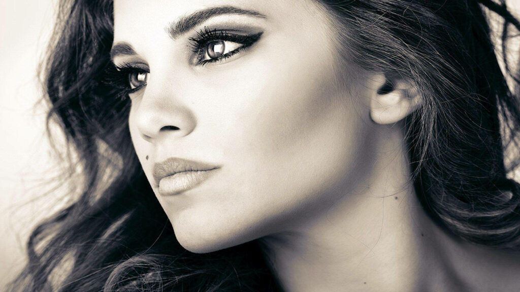 Greyscale close-up portrait of Alyssa Milano with expressive eyes and elegant features wallpaper