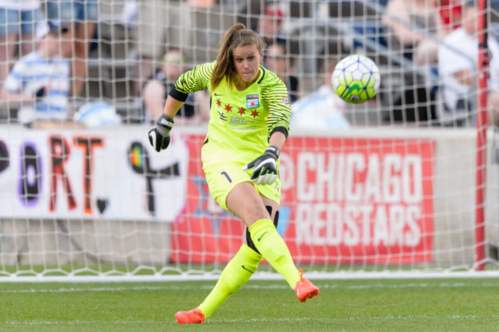 Alyssa Naeher making a save during Chicago Red Stars soccer match showing goalkeeping skills Wallpaper