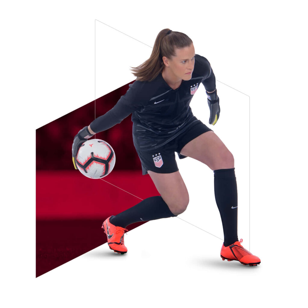 Alyssa Naeher USWNT goalkeeper focused holding soccer ball during match action wallpaper background