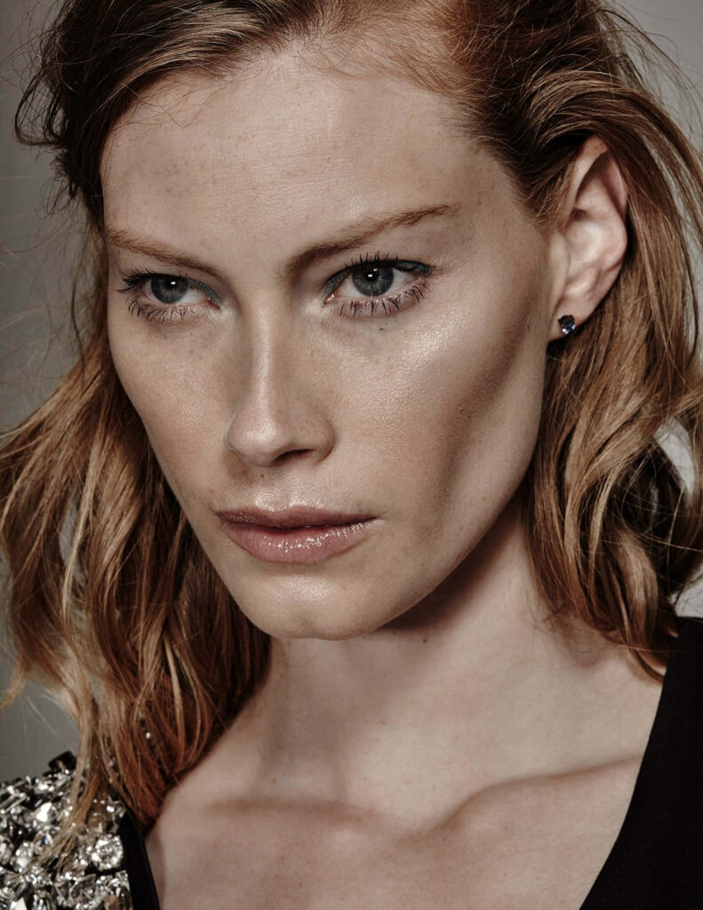 Close-up portrait of Alyssa Sutherland with intense gaze sharp features natural beauty wallpaper