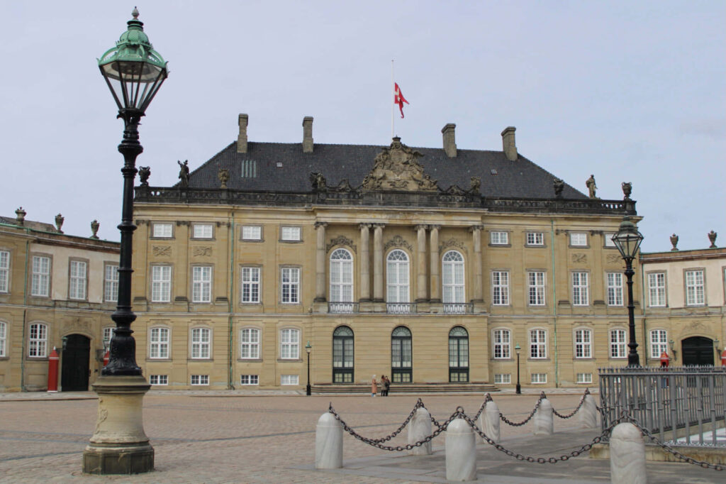 Amalienborg Palace with classical architecture and elegant courtyard under calm sky wallpaper