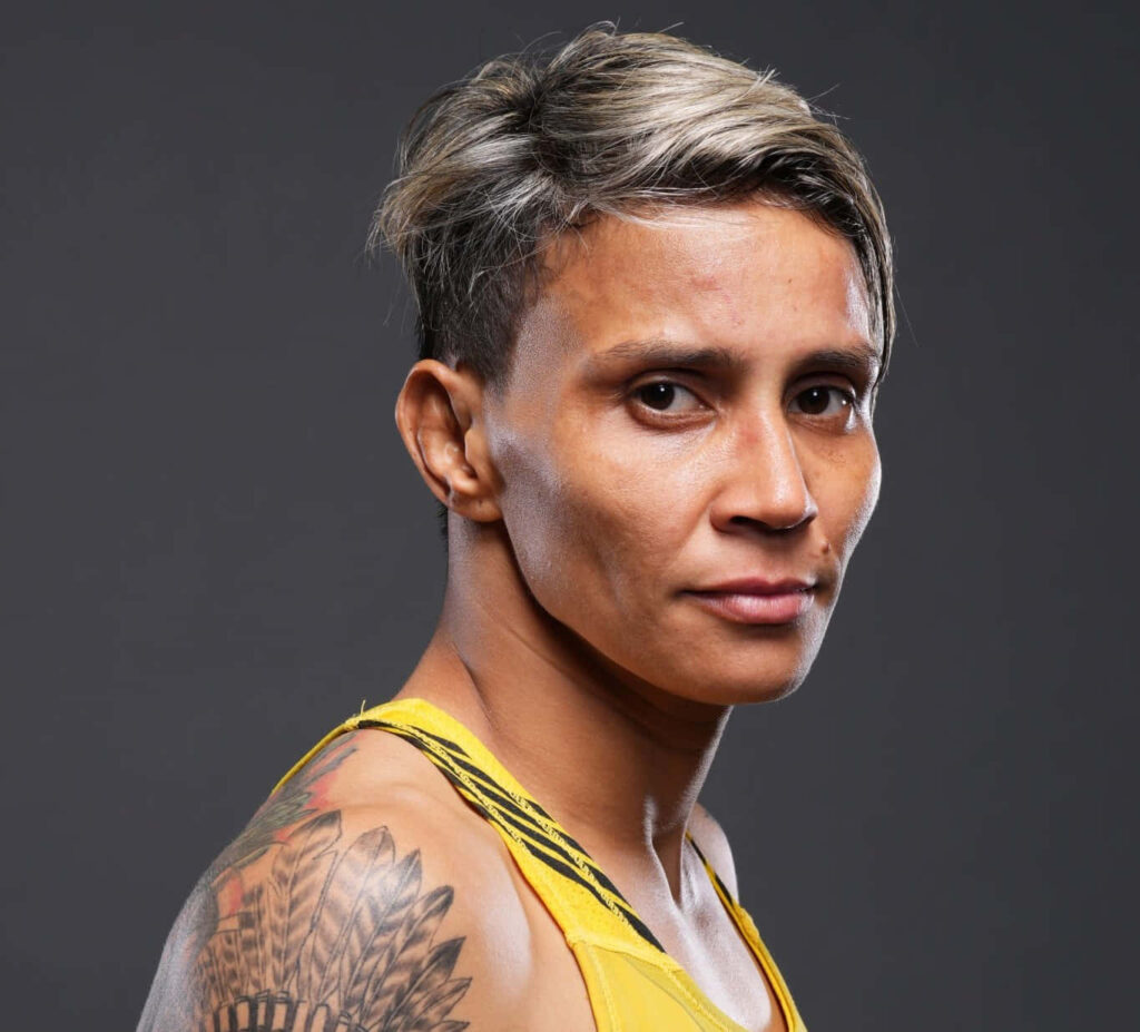 Amanda Lemos athlete portrait wallpaper showcasing focus strength and determination on dark background