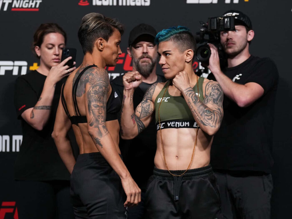 Amanda Lemos intense UFC fighters staredown showing determination before their bout wallpaper background