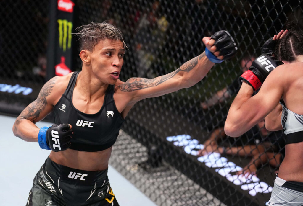 Amanda Lemos UFC fight action showing striking skills and intense focus inside the octagon Wallpaper