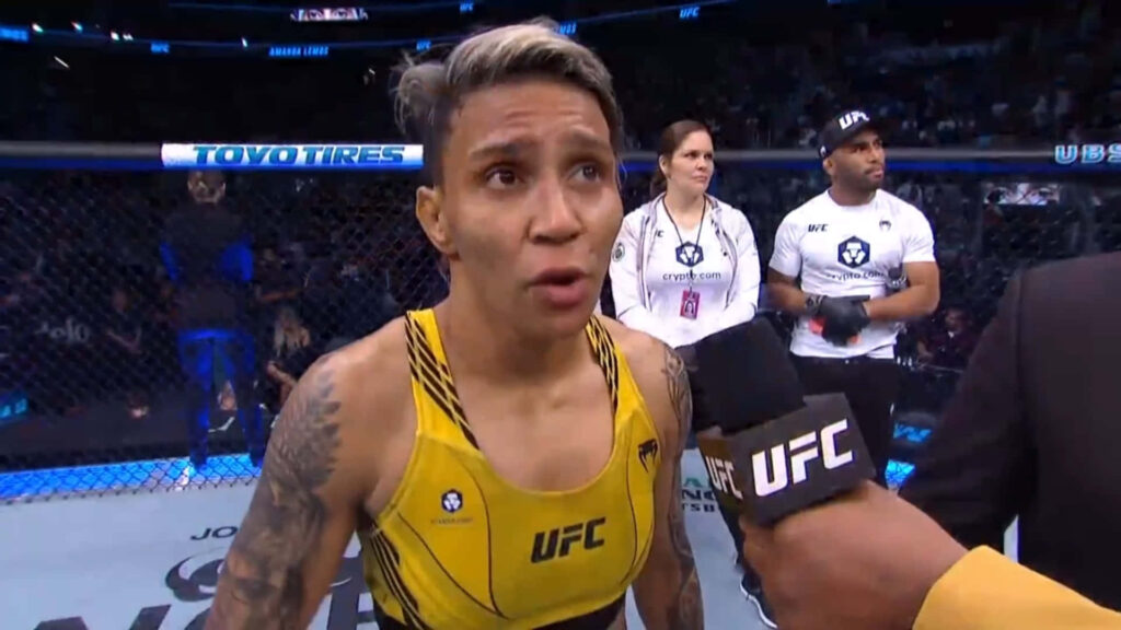 Amanda Lemos UFC octagon focused determined after intense fight showcasing strength resilience Wallpaper