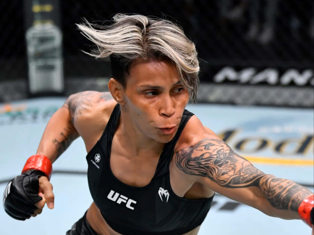 Amanda Lemos intense focused UFC fighter mid-fight high-energy octagon wallpaper background