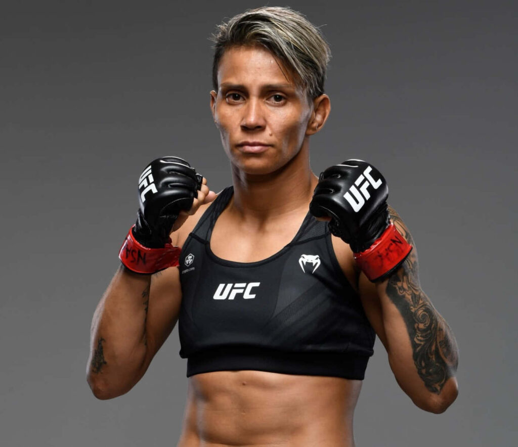 Amanda Lemos UFC fighter portrait showing determined expression and athletic physique in gear Wallpaper