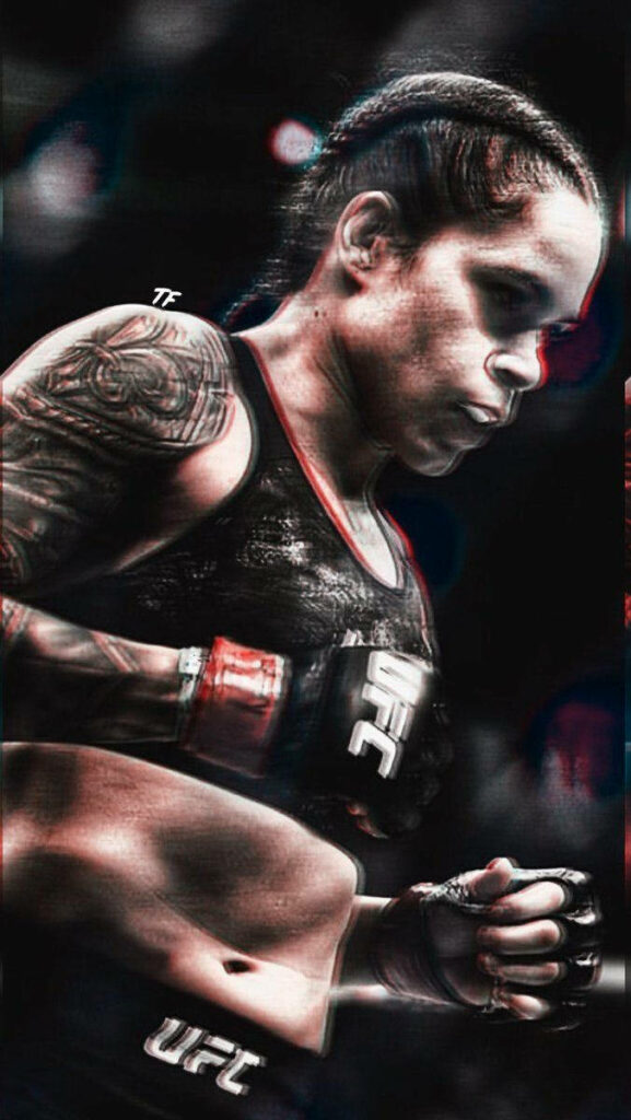 Amanda Nunes UFC champion in octagon showing strength determination intense focus wallpaper