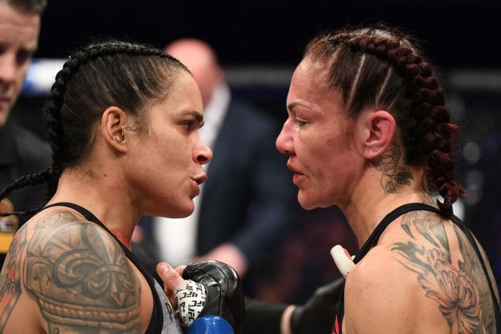 Amanda Nunes and Cris Cyborg intense staredown before high stakes MMA fight wallpaper background