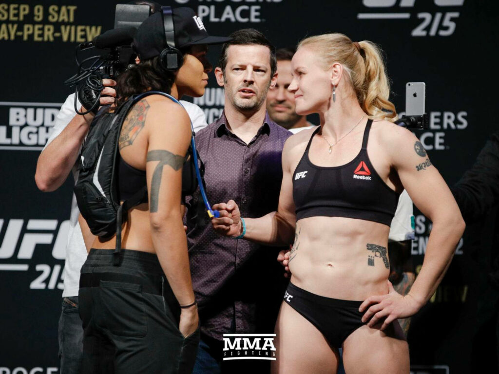 Amanda Nunes and Valentina Shevchenko UFC weigh-in intense stare down showcasing focus and determination Wallpaper