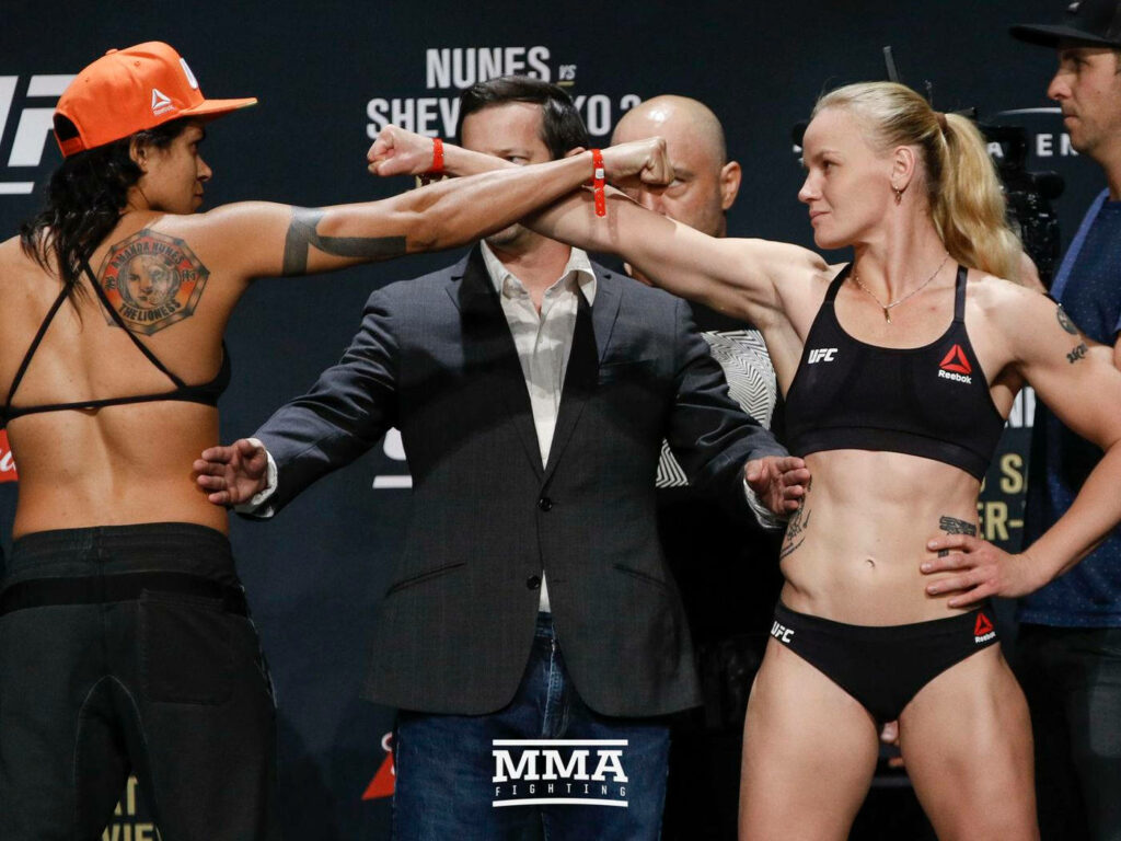 Amanda Nunes and Valentina Shevchenko intense UFC weigh-in face off MMA wallpaper background