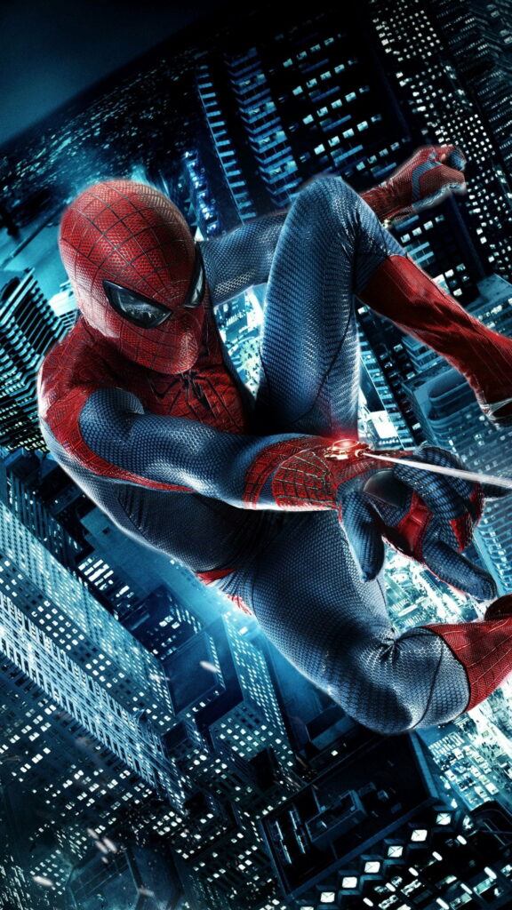 The Amazing Spider-Man swings above city lights at night in iconic suit HD phone wallpaper.