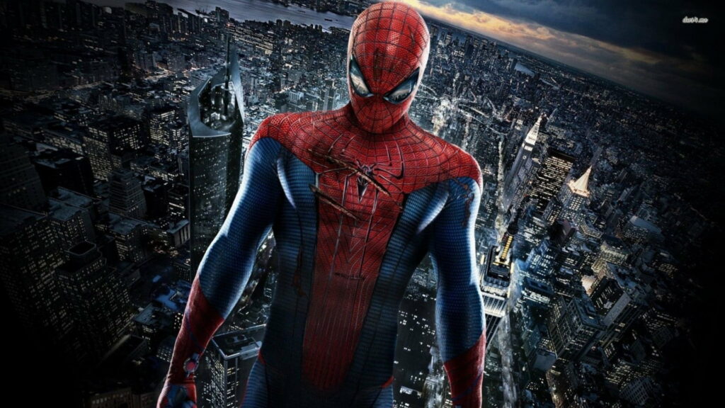 The Amazing Spiderman on city rooftop at night with vibrant skyline, HD superhero wallpaper