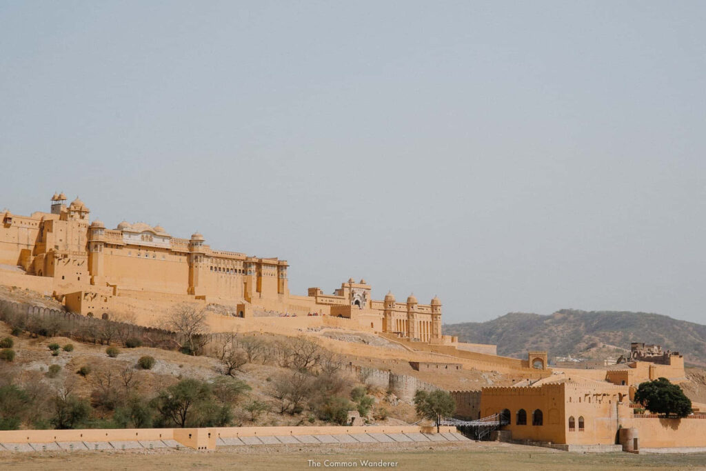 Amber Fort majestic architecture under gloomy sky with arid landscape historic Amer Fort view Wallpaper